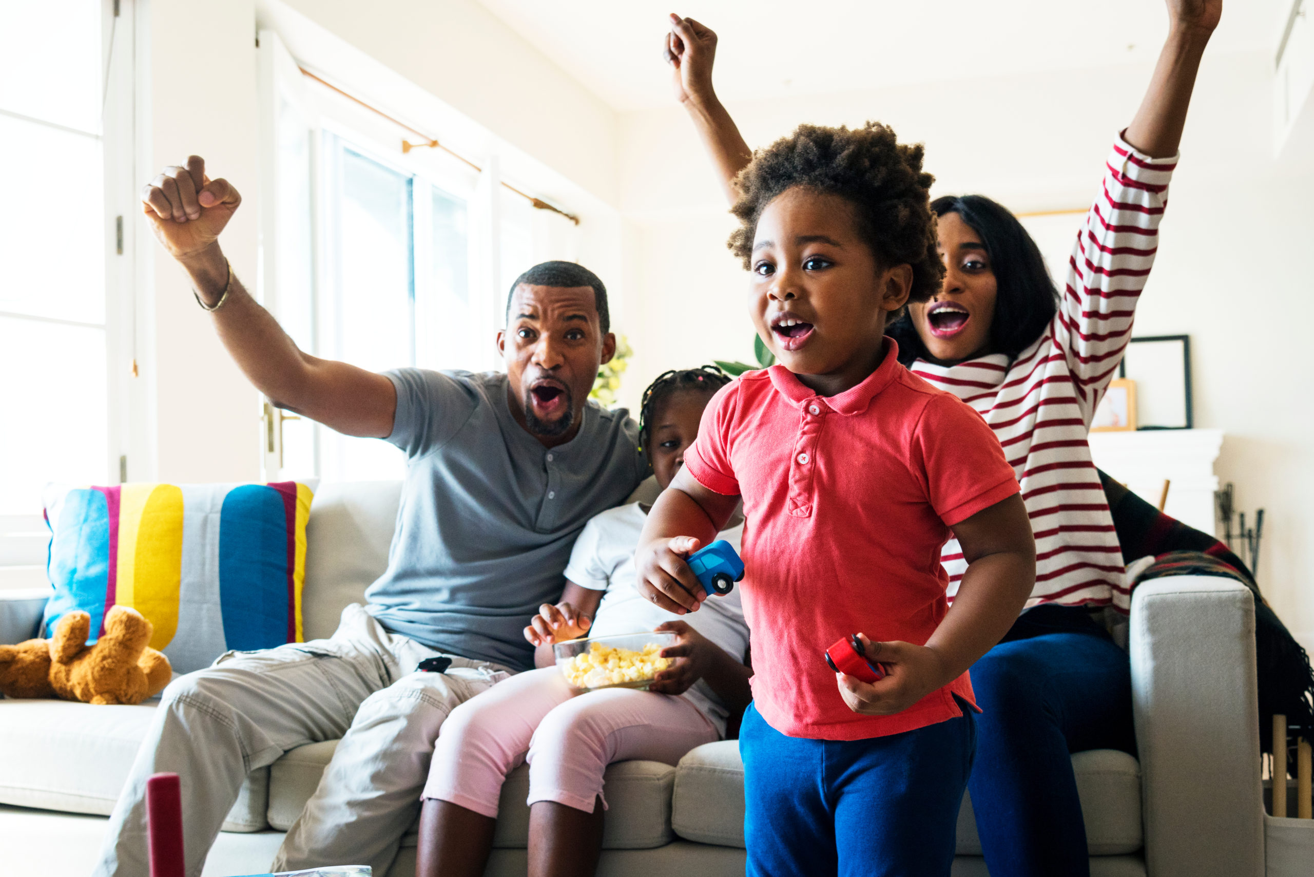 Family excited watching TV